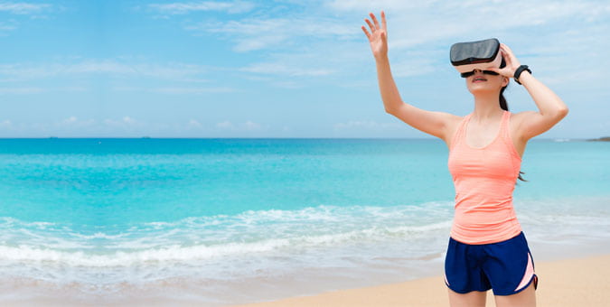 Woman on the beach with headset on